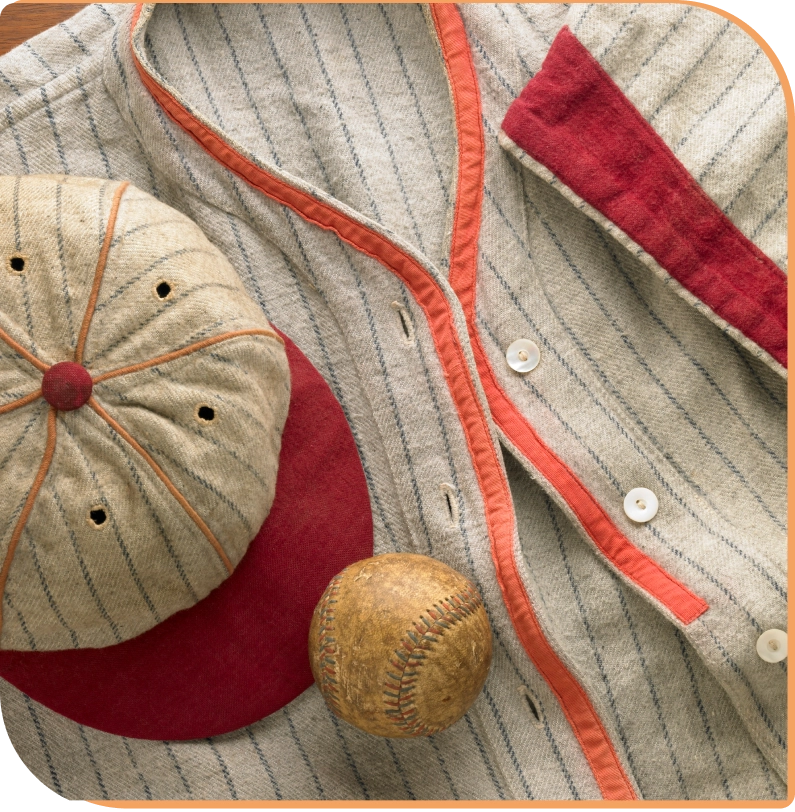 Vintage baseball uniform, cap, and ball.